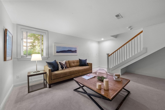 382 E Town St, Columbus, OH 43215 - living room with carpet flooring, stairs, and baseboards