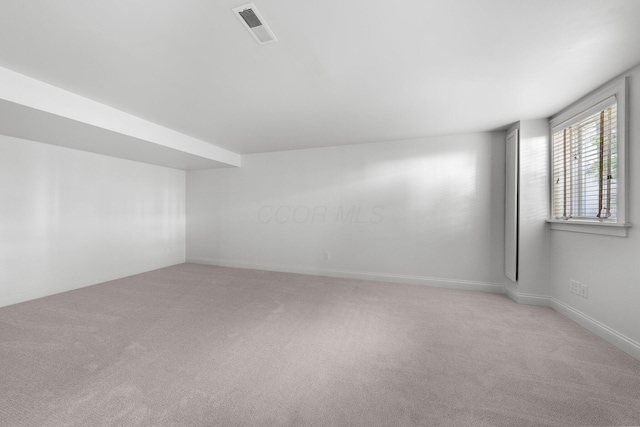 382 E Town St, Columbus, OH 43215 - additional living space with light carpet and baseboards