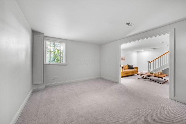 382 E Town St, Columbus, OH 43215 - spare room featuring light carpet and baseboards
