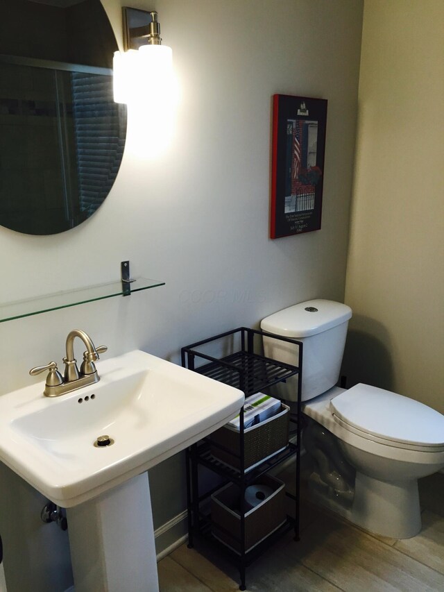 382 E Town St, Columbus, OH 43215 - bathroom with toilet, wood finished floors, and a sink