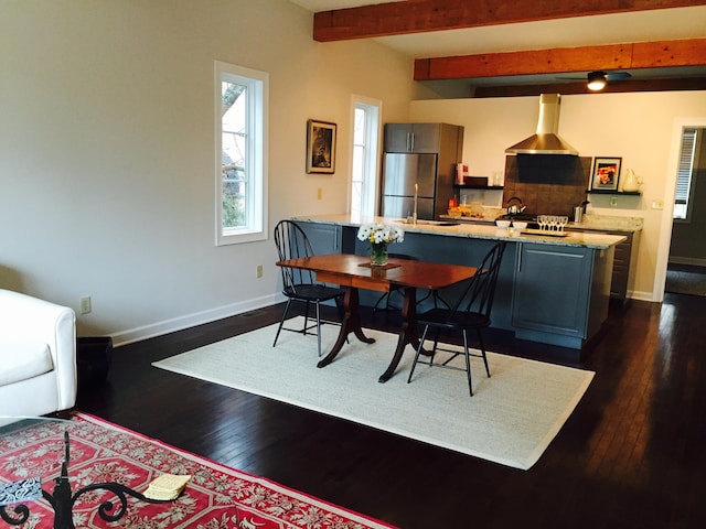 382 E Town St, Columbus, OH 43215 - dining area featuring baseboards, dark wood-style flooring, and beamed ceiling