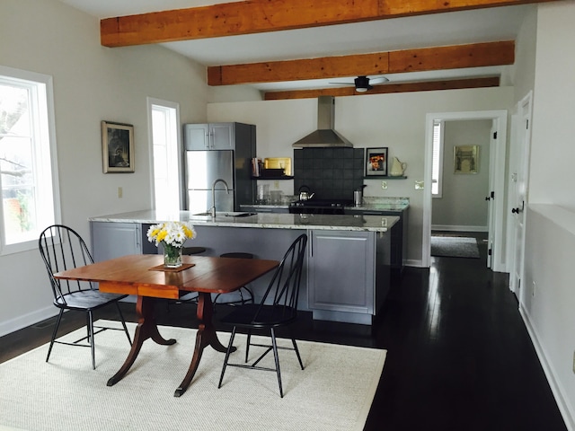 382 E Town St, Columbus, OH 43215 - dining room with healthy amount of natural light, baseboards, dark wood finished floors, beamed ceiling, and a ceiling fan