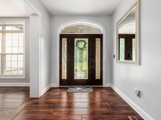 5046 Clark-Shaw Rd, Powell, OH 43065 - foyer featuring healthy amount of natural light, baseboards, and dark wood-style flooring