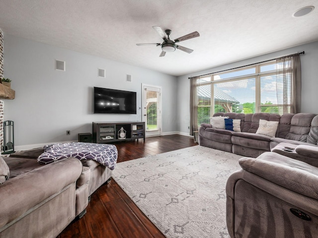 5046 Clark-Shaw Rd, Powell, OH 43065 - living area with a ceiling fan, dark wood-style flooring, and baseboards