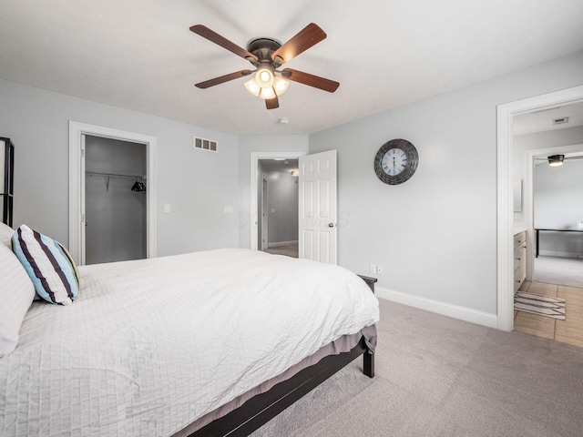 5046 Clark-Shaw Rd, Powell, OH 43065 - carpeted bedroom featuring baseboards, a ceiling fan, and a walk in closet
