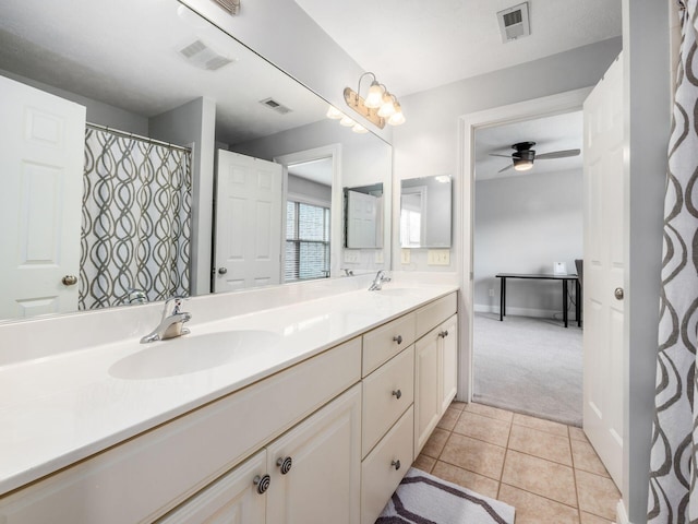 5046 Clark-Shaw Rd, Powell, OH 43065 - bathroom featuring double vanity, ceiling fan, tile patterned floors, and baseboards