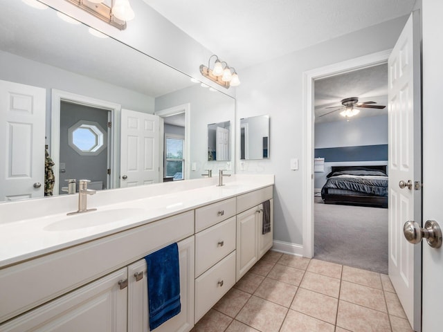 5046 Clark-Shaw Rd, Powell, OH 43065 - bathroom featuring ensuite bathroom, double vanity, baseboards, tile patterned flooring, and a ceiling fan