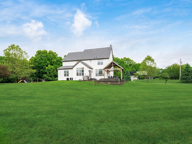 5046 Clark-Shaw Rd, Powell, OH 43065 - back of house with a gazebo, a yard, and stucco siding