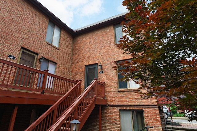 277 Lear St Unit 11, Columbus, OH 43206 - back of property with brick siding, stairs, and a wooden deck