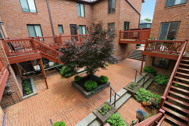 277 Lear St Unit 11, Columbus, OH 43206 - view of patio / terrace featuring stairs and a wooden deck