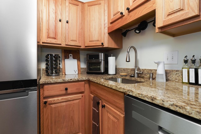 277 Lear St Unit 11, Columbus, OH 43206 - kitchen with appliances with stainless steel finishes, a sink, and light stone counters