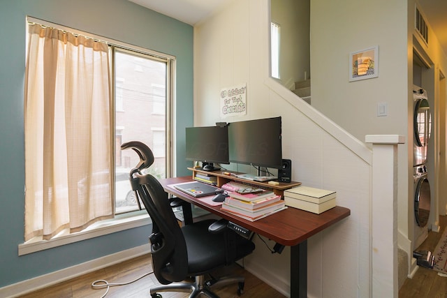 277 Lear St Unit 11, Columbus, OH 43206 - office with stacked washing machine and dryer, wood finished floors, and healthy amount of natural light