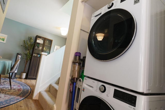 277 Lear St Unit 11, Columbus, OH 43206 - washroom featuring estacked washer and dryer and wood finished floors