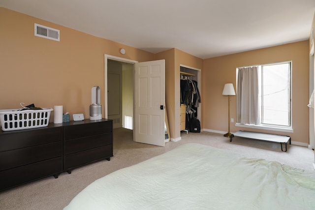277 Lear St Unit 11, Columbus, OH 43206 - bedroom featuring light colored carpet, a closet, and baseboards
