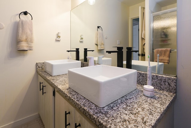 277 Lear St Unit 11, Columbus, OH 43206 - full bath with double vanity and baseboards