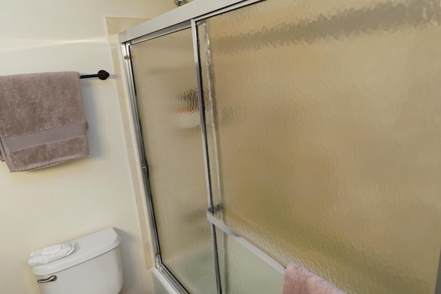 277 Lear St Unit 11, Columbus, OH 43206 - bathroom featuring toilet and shower / bath combination with glass door