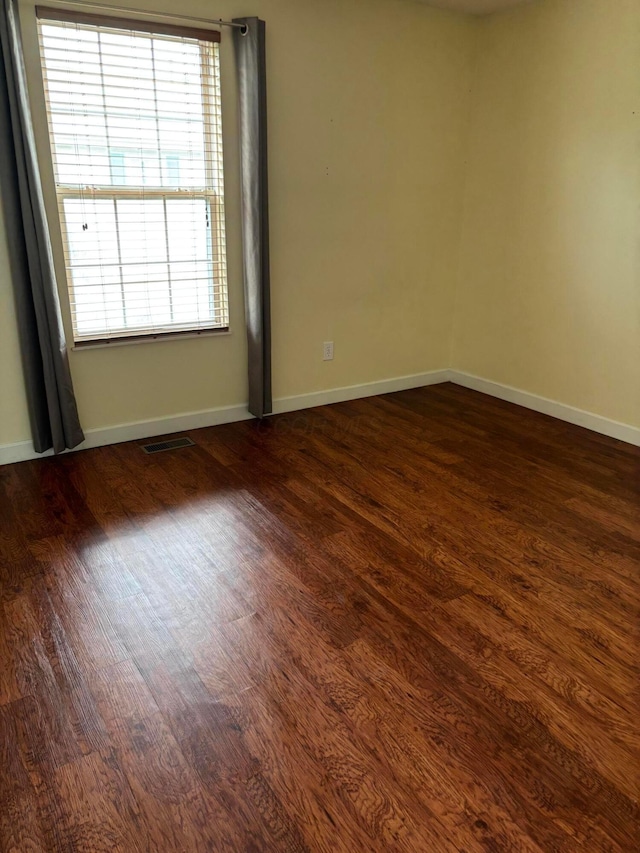 2037 Burbridge Ln Unit 31B, Hilliard, OH 43026 - empty room with dark wood-style floors and baseboards
