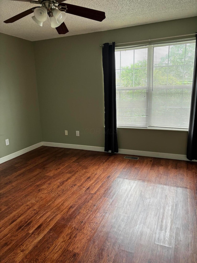 2037 Burbridge Ln Unit 31B, Hilliard, OH 43026 - spare room with a ceiling fan, dark wood finished floors, baseboards, and a textured ceiling