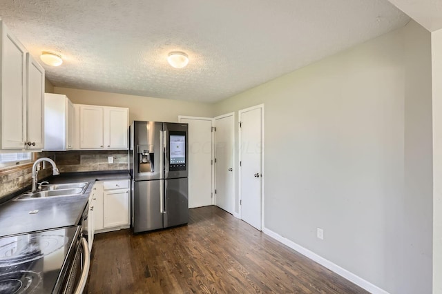 1041 Clifton Chase Dr, Galloway, OH 43119 - kitchen featuring stainless steel fridge with ice dispenser, a sink, range with electric stovetop, white cabinets, and a textured ceiling