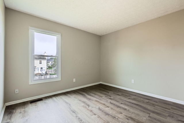 1041 Clifton Chase Dr, Galloway, OH 43119 - spare room with wood finished floors and baseboards