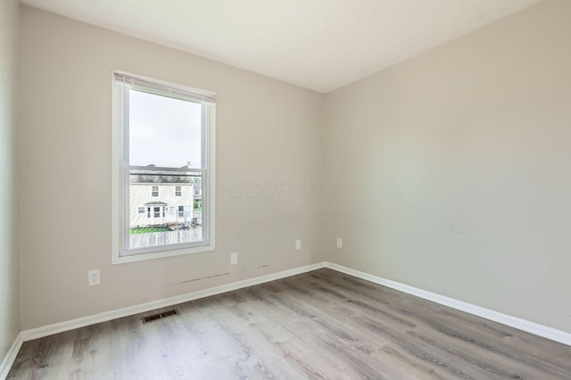 1041 Clifton Chase Dr, Galloway, OH 43119 - unfurnished room with wood finished floors and baseboards