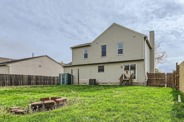 1041 Clifton Chase Dr, Galloway, OH 43119 - back of property featuring entry steps, cooling unit, a shed, and an outdoor structure