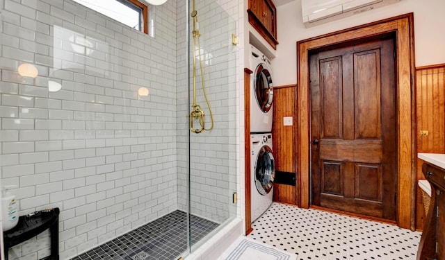 758 S Front St, Columbus, OH 43206 - full bath with stacked washer / dryer, a stall shower, a wall mounted air conditioner, wooden walls, and wainscoting