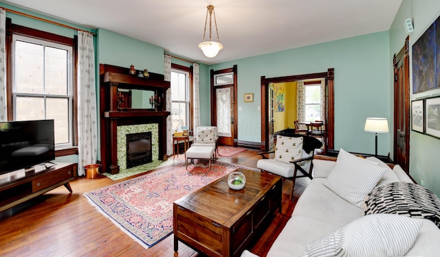 758 S Front St, Columbus, OH 43206 - living room featuring hardwood / wood-style flooring, a fireplace, and plenty of natural light