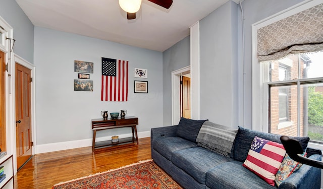 758 S Front St, Columbus, OH 43206 - living room featuring wood finished floors, a ceiling fan, and baseboards