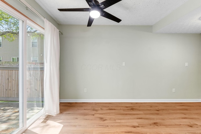 905 Soramill Ln, Columbus, OH 43085 - unfurnished room featuring light wood-type flooring, a textured ceiling, ceiling fan, and baseboards