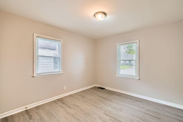 2454 Joyce Ave, Columbus, OH 43211 - empty room with wood finished floors and baseboards
