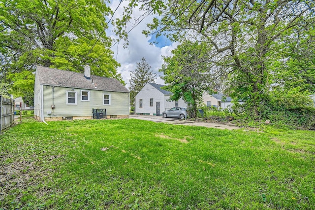 2454 Joyce Ave, Columbus, OH 43211 - rear view of house featuring a chimney