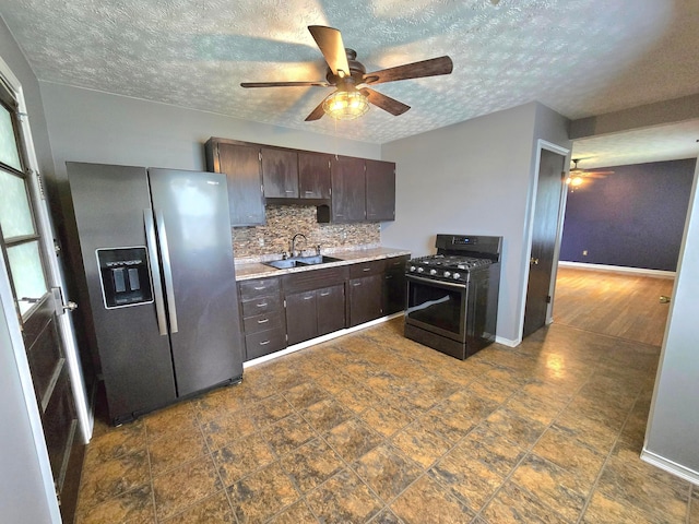 568 Brookdale Dr, West Jefferson, OH 43162 - kitchen with stainless steel fridge, gas stove, a sink, ceiling fan, and a textured ceiling