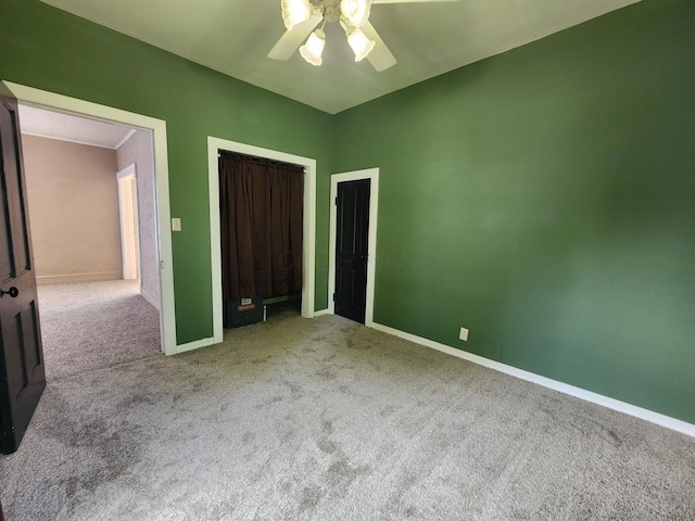 7703 County Road 91, Lewistown, OH 43333 - unfurnished bedroom featuring carpet floors, baseboards, a ceiling fan, and a closet
