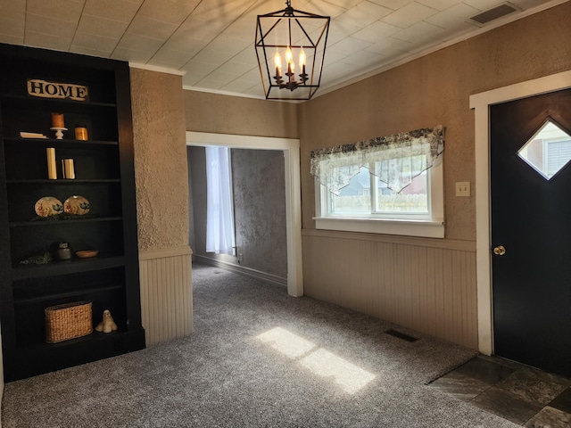 7703 County Road 91, Lewistown, OH 43333 - carpeted entryway with plenty of natural light and a chandelier