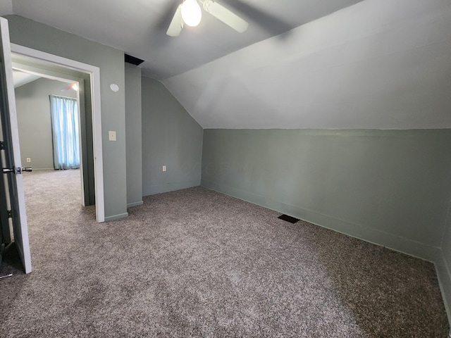 7703 County Road 91, Lewistown, OH 43333 - additional living space with lofted ceiling, carpet, ceiling fan, and baseboards