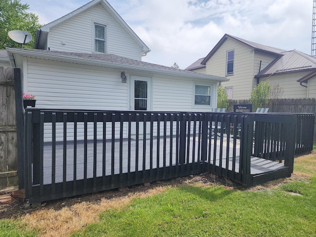 7703 County Road 91, Lewistown, OH 43333 - back of house with a wooden deck and roof with shingles