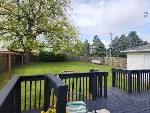 7703 County Road 91, Lewistown, OH 43333 - deck featuring an outdoor fire pit