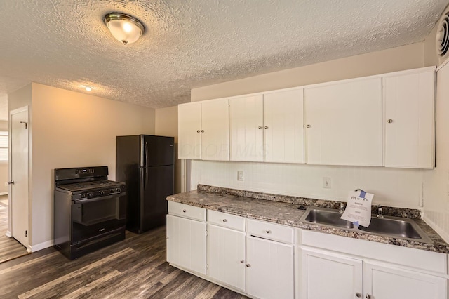 4309 Walford St, Columbus, OH 43224 - kitchen with black appliances, dark wood-style floors, white cabinetry, a textured ceiling, and dark countertops