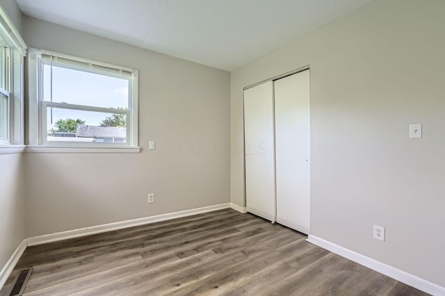4309 Walford St, Columbus, OH 43224 - unfurnished bedroom with wood finished floors and a closet