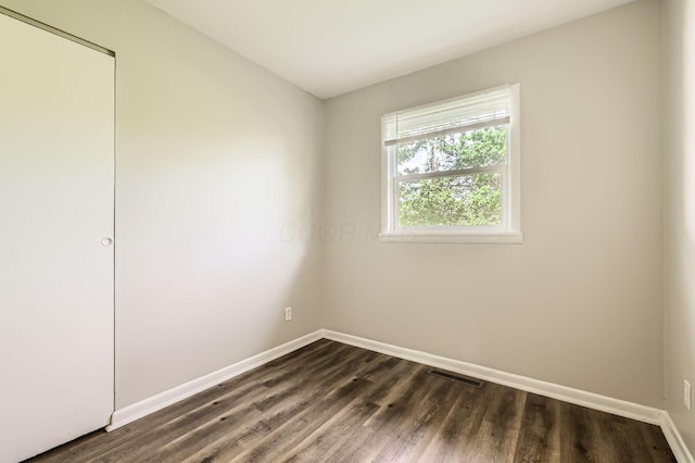 4309 Walford St, Columbus, OH 43224 - spare room with baseboards and dark wood-style flooring