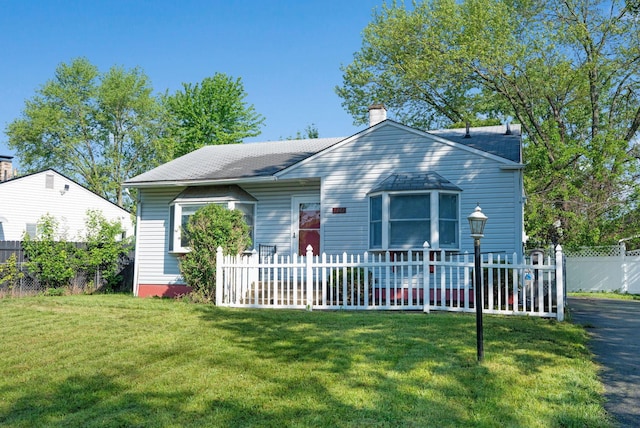 bungalow-style house with a chimney and a shingled roof