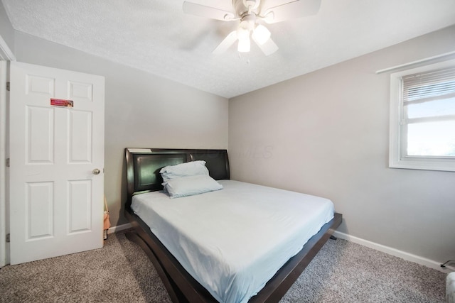 bedroom with carpet, baseboards, and ceiling fan