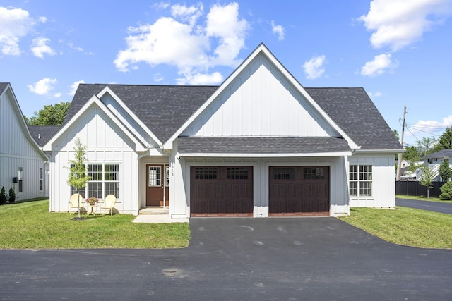 3918 Logan Ct, Hilliard, OH 43026 - modern farmhouse style home featuring an attached garage, board and batten siding, roof with shingles, and driveway