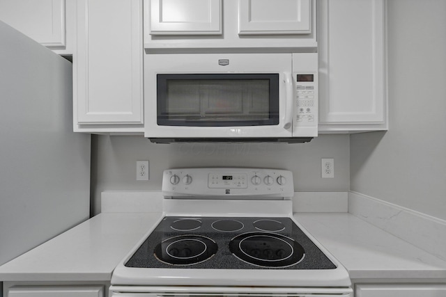5394 Ambrosia Ave Unit 21B, Columbus, OH 43235 - kitchen with white appliances, light countertops, and white cabinets