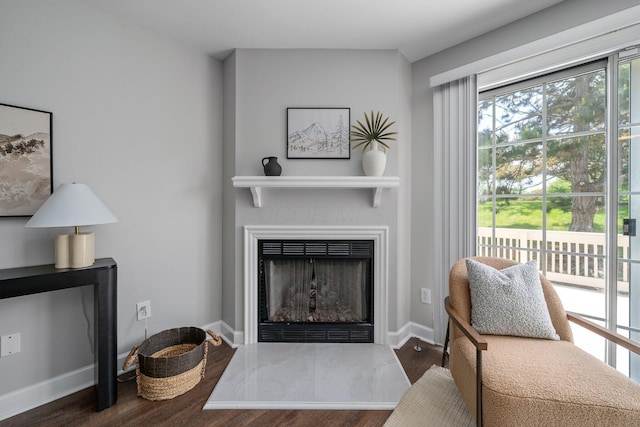 5394 Ambrosia Ave Unit 21B, Columbus, OH 43235 - living area featuring wood finished floors and a fireplace