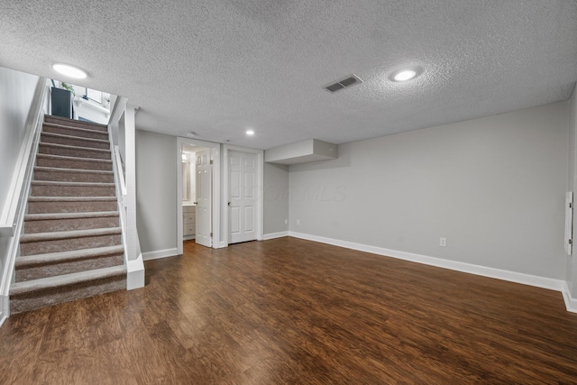 5394 Ambrosia Ave Unit 21B, Columbus, OH 43235 - finished below grade area featuring wood finished floors, a textured ceiling, baseboards, stairs, and recessed lighting