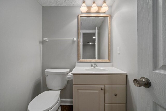 5394 Ambrosia Ave Unit 21B, Columbus, OH 43235 - bathroom featuring vanity, toilet, and a textured ceiling