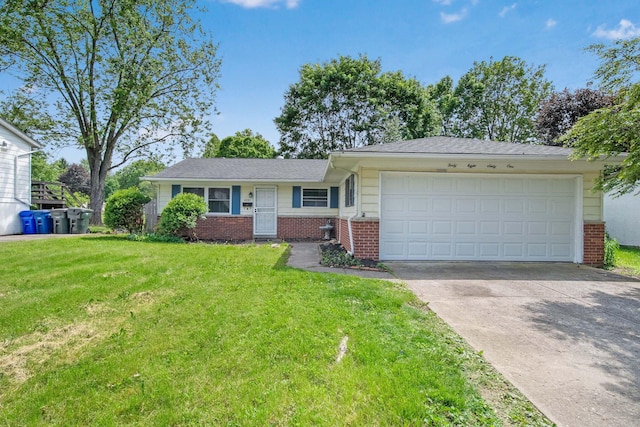 4861 Warminster Dr, Columbus, OH 43232 - single story home with brick siding, an attached garage, concrete driveway, and a front yard