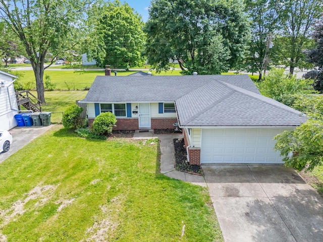 4861 Warminster Dr, Columbus, OH 43232 - single story home with brick siding, concrete driveway, a front yard, and an attached garage